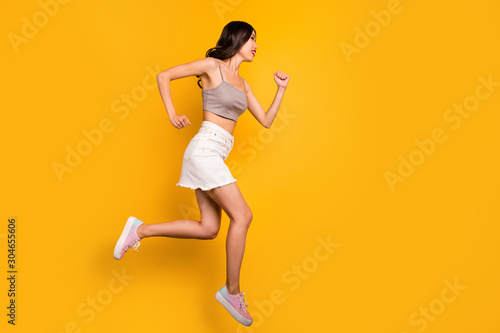 Side profile full length body size photo of cheerful positive cute pretty nice girlfriend running towards jumping sales isolated vivid color background