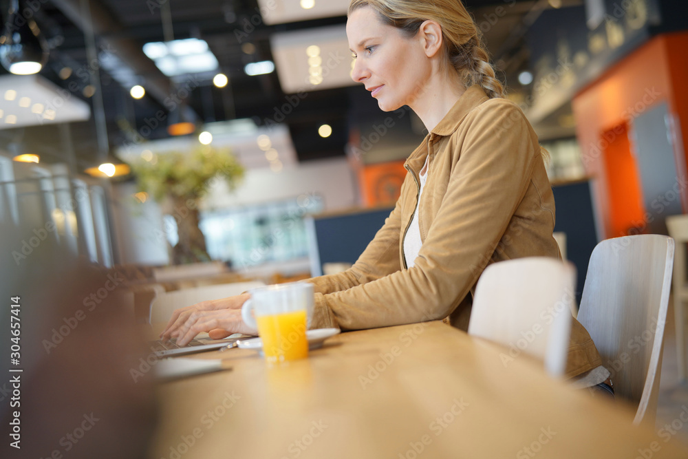 young businesswoman in a cafeteria young businesswoman in a cafeteria
