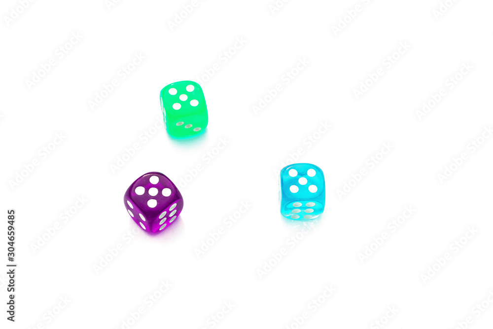 number five on the edges of the die, three multi-colored dice on white background number five on the edges of the die, three multi-colored dice on white background