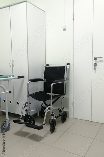 Wheelchair for patients. Selective focus. chair for transporting patients in hospital corridor