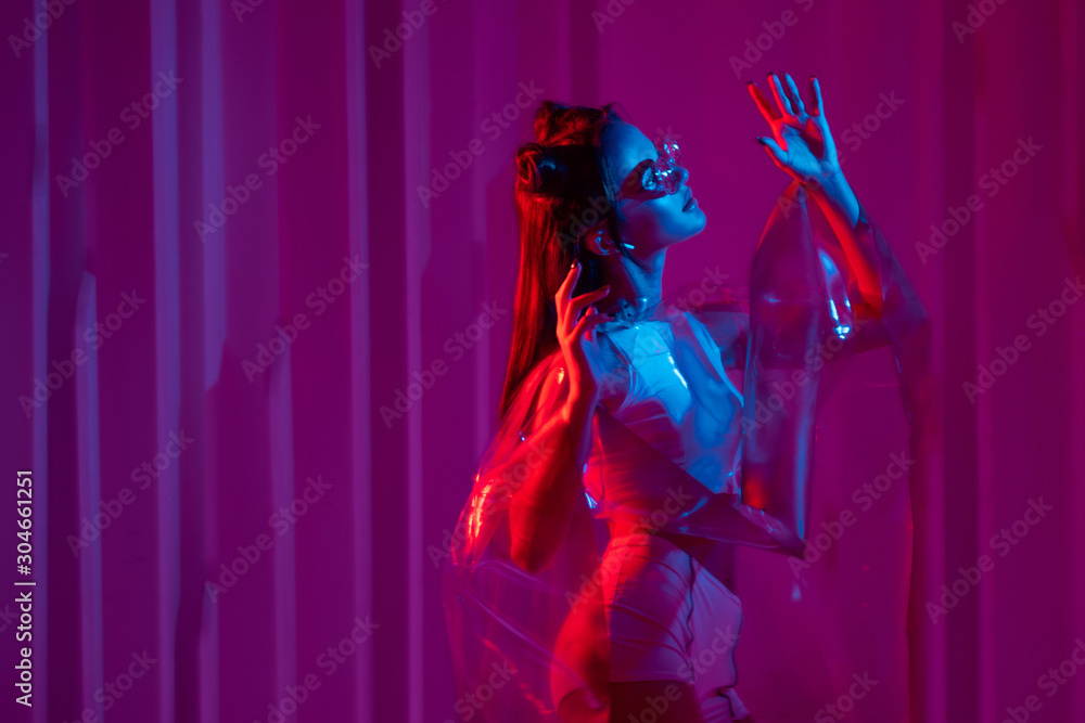Cyberpunk and neon, a young trend girl in a transparent latex raincoat Cyberpunk and neon, a young trend girl in a transparent latex raincoat