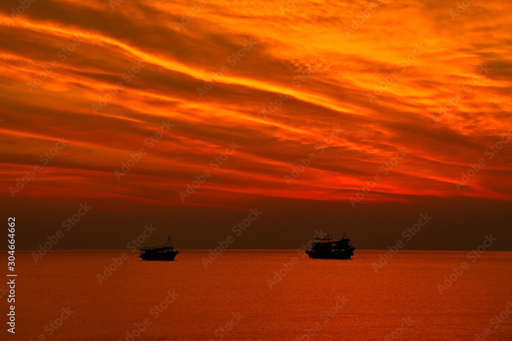 summer. Beautiful natural background of sunset with 2 boat on vacation