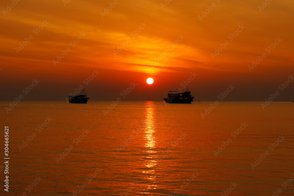 summer. Beautiful natural background of sunset with 2 boat on vacation