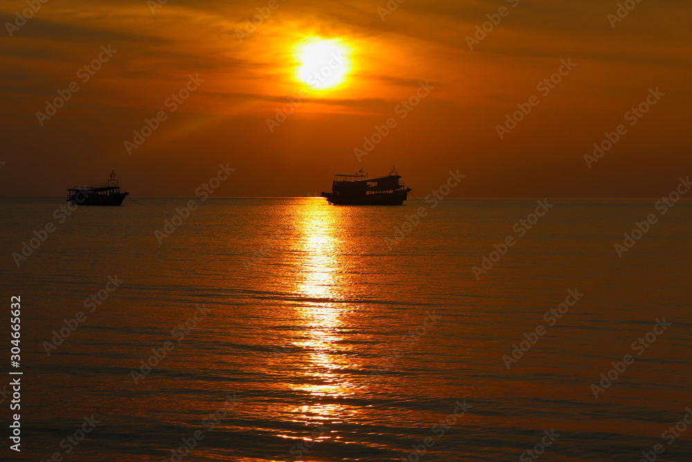 summer. Beautiful natural background of sunset with boat on vacation