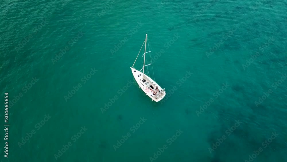 Aerial: Beautiful 4K following a small yacht - a bird eye view of Vodice coast from above - Drone top view at Sunset Aerial: Beautiful 4K following a small yacht - a bird eye view of Vodice coast from above - Drone top view at Sunset