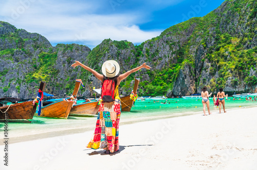 Summer lifestyle woman traveler joy on sunny beach Maya bay Phi Phi island Krabi  Famous place tourist travel Phuket Thailand fun beach  Tourism beautiful destination Asia summer holiday vacation trip