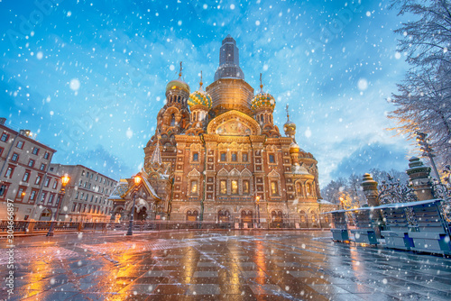 View of famous church of Savior on Spilled Blood (Resurrection of Christ cathedral) and Griboedov Canal at frosty snow winter morning day, Saint Petersburg, Russia. Christmas mood photo