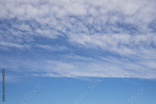 Fototapeta Naklejka Na Ścianę i Meble -  Wave of softy and white fluffy clouds under deep blue sky