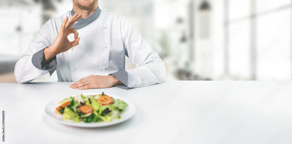 chef in restaurant showing ok sign with copy space chef in restaurant showing ok sign with copy space
