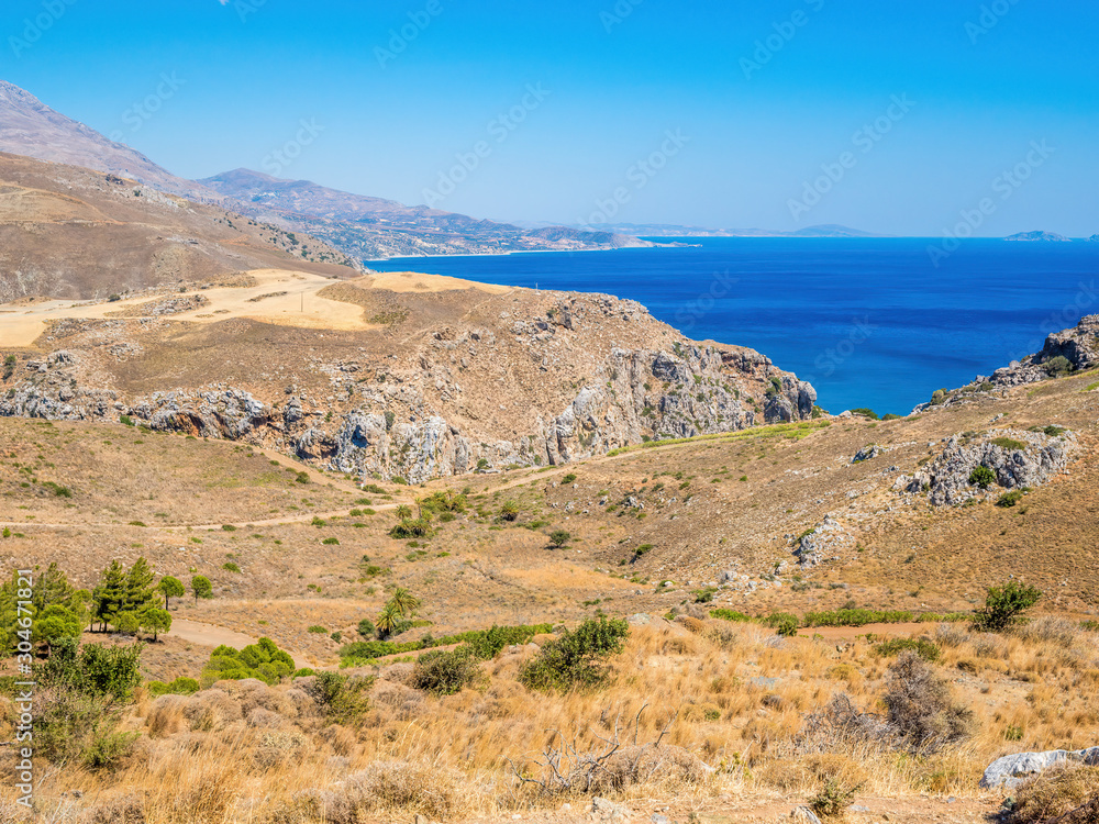 Road to Preveli beach (Palm beach) at Libyan sea, Crete, Greece. Preveli beach and lagoon is located below the monastery in from of an extensive glade of palm trees