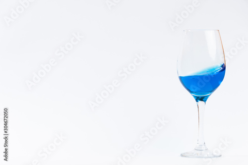 glass whith blue water