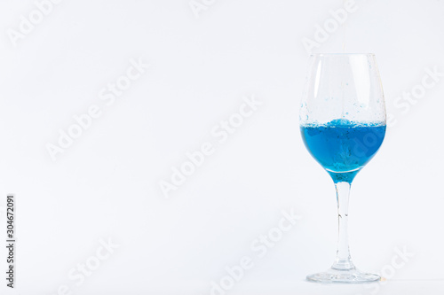 glass whith blue water