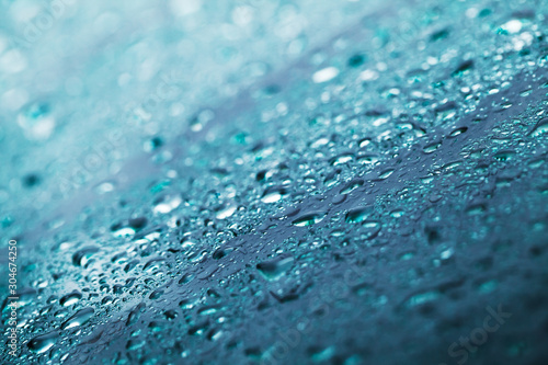 Blue wet windshield, glass surface