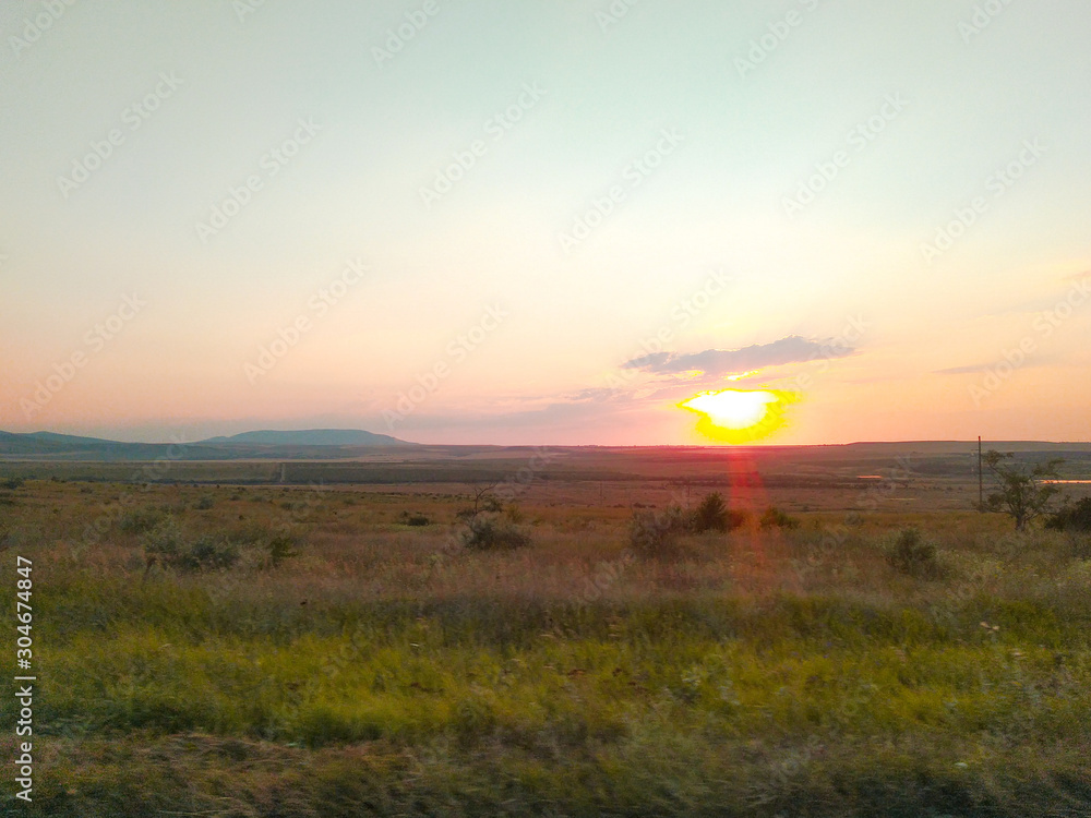 Obraz premium Bright sunset over the field, Crimea