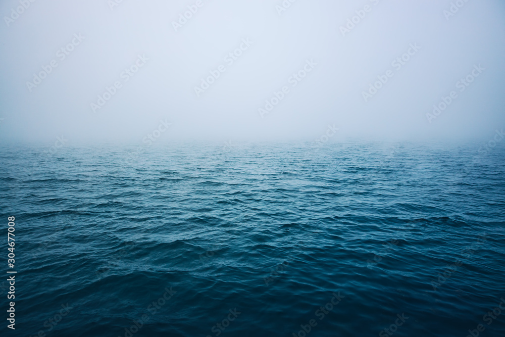 Fototapeta Sea ripple water with morning fog