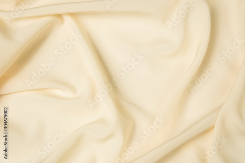 Abstract folds. Delicate silk drapery. Beige color.