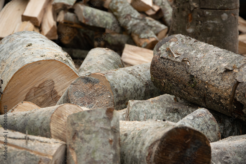 Preparation for firewood for the winter. Dry chopped wooden woodpile Preparation for firewood for the winter. Dry chopped wooden woodpile