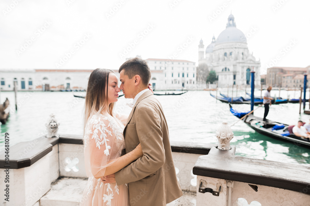 Wedding couple on the nature is hugging each other. Beautiful model girl in white dress. Man in suit.Venice, Italy Wedding couple on the nature is hugging each other. Beautiful model girl in white dress. Man in suit.Venice, Italy