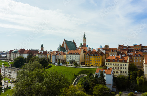 Aerial view of old buildings, castles and a church in the old city of Warsaw. Poland. Flight of the drone over the old city on a sunny summer day. © Oleksandr