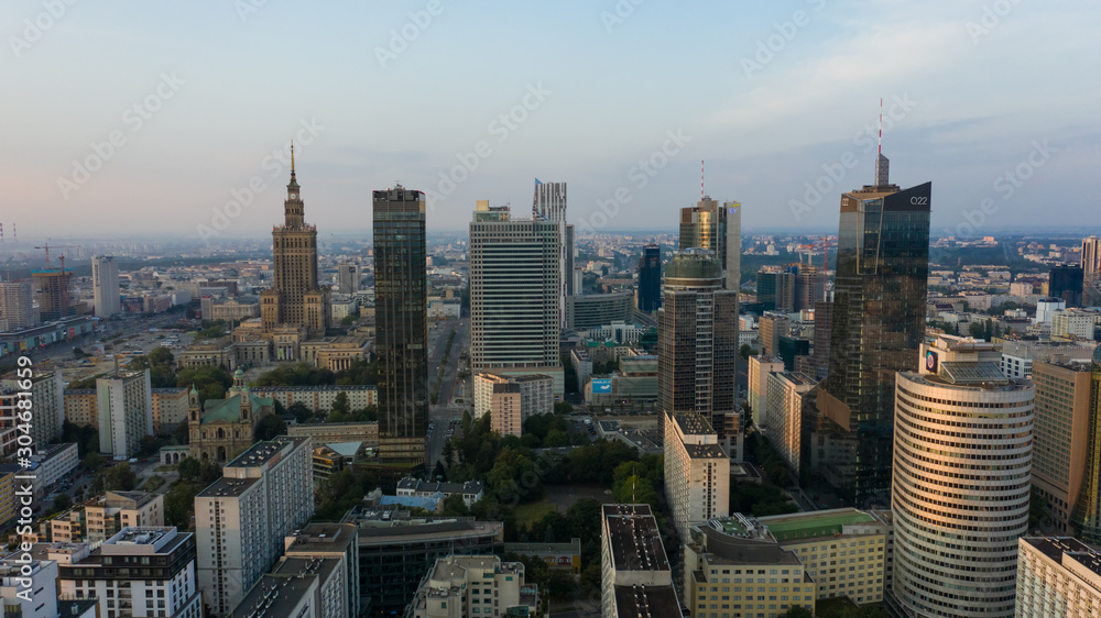 Fototapeta premium Warsaw Poland. 16. July. 2019. Aerial view of modern skyscrapers and buildings at sunrise. City in the foggy mist.