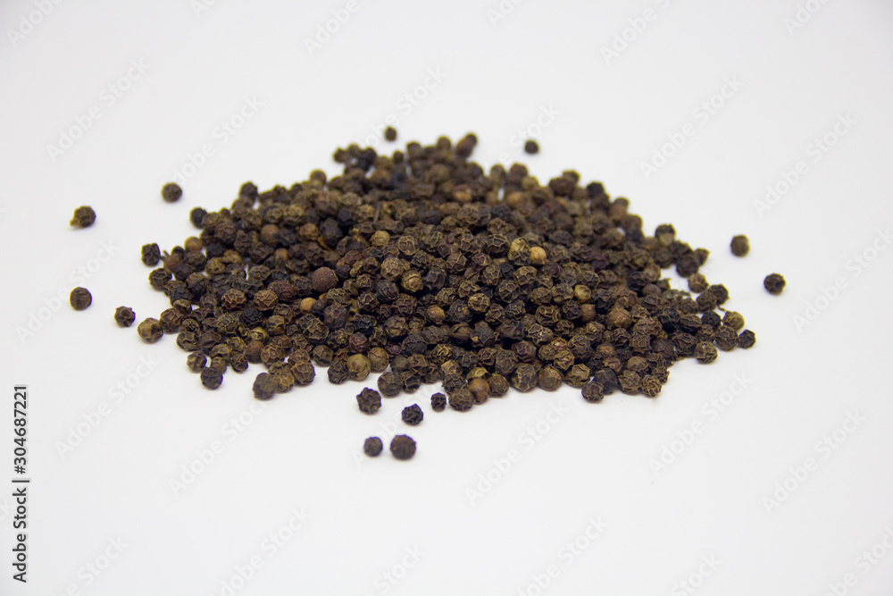 slide of black pepper on a white background