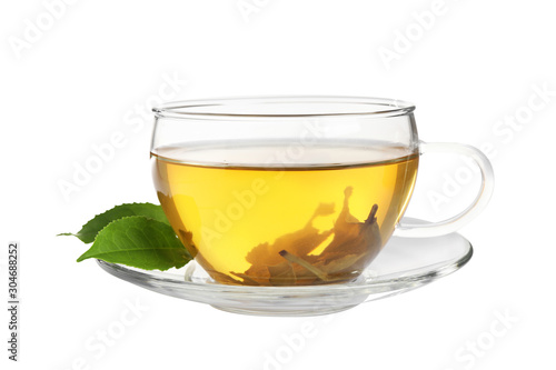 Cup of green tea and leaves isolated on white