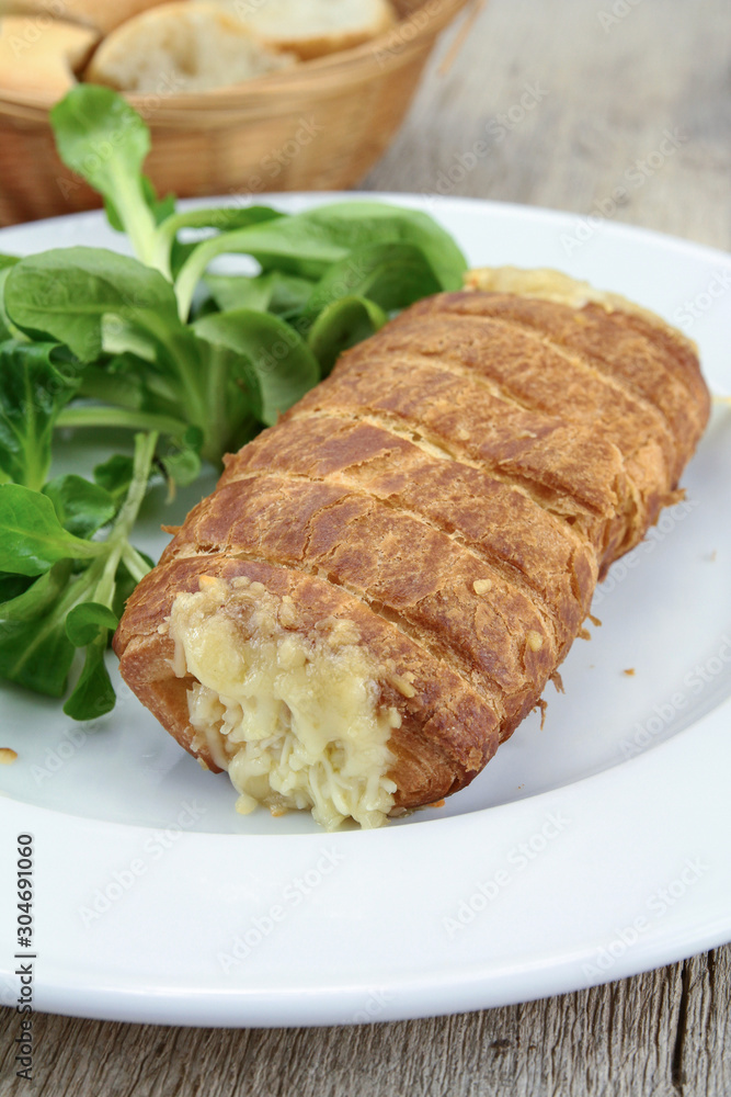 cheese and bechamel puff pastry on a plate cheese and bechamel puff pastry on a plate