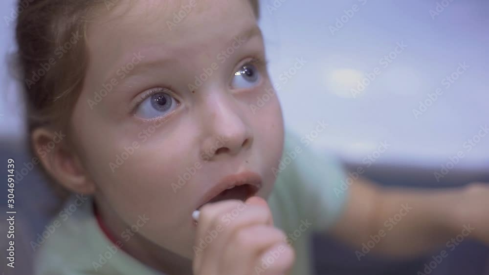 Little girl f brushing her teeth with a toothbrush in bathroom in the morning. Little girl f brushing her teeth with a toothbrush in bathroom in the morning.