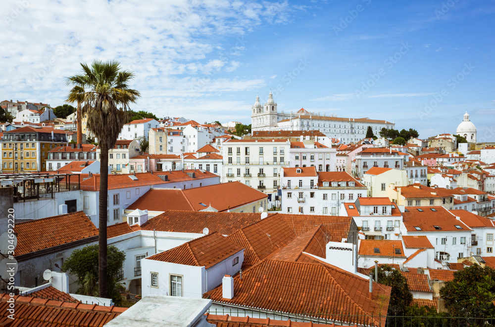 Lisbon, Portugal - May, 22nd, 2018 : High angle view of the Alfama old town as seen from the Miradouro das Portas do Sol viewpoint. Lisbon, Portugal - May, 22nd, 2018 : High angle view of the Alfama old town as seen from the Miradouro das Portas do Sol viewpoint.