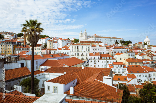 Lisbon, Portugal - May, 22nd, 2018 : High angle view of the Alfama old town as seen from the Miradouro das Portas do Sol viewpoint.