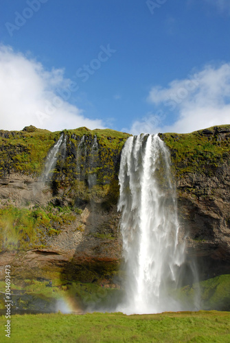 Seljalandsfoss Waterfall in Iceland. A famous waterfall with a path to walk behind the falls.