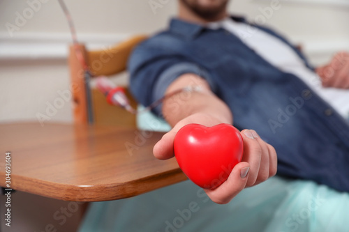 Fotografija Man donating blood in hospital, closeup view