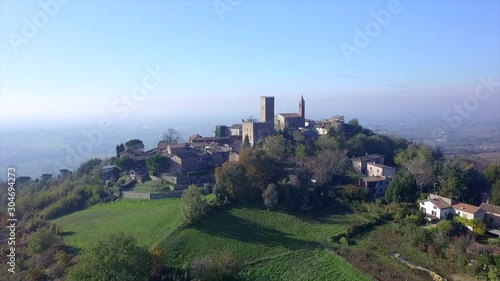 4k aerial forward drone footage on the antique village of Rivanazzano, in Oltrepò Pavese countryside near Pavia, Italy. photo