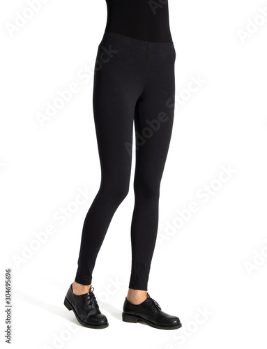 Woman wear black blank leggings mockup, isolated, clipping path. Women in clear leggins template. Cloth pants design presentation. Sport pantaloons stretch tights model wearing. Slim legs in apparel