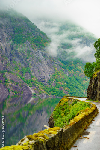 Old road along fjord Eidfjorden  Norway