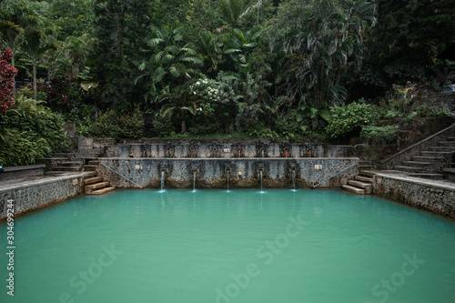 Beautiful stone pool with hot springs in the jungle of Bali