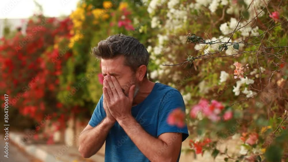 Young funny handsome man with beard and mustache sneezing funny Young funny handsome man with beard and mustache sneezing funny
