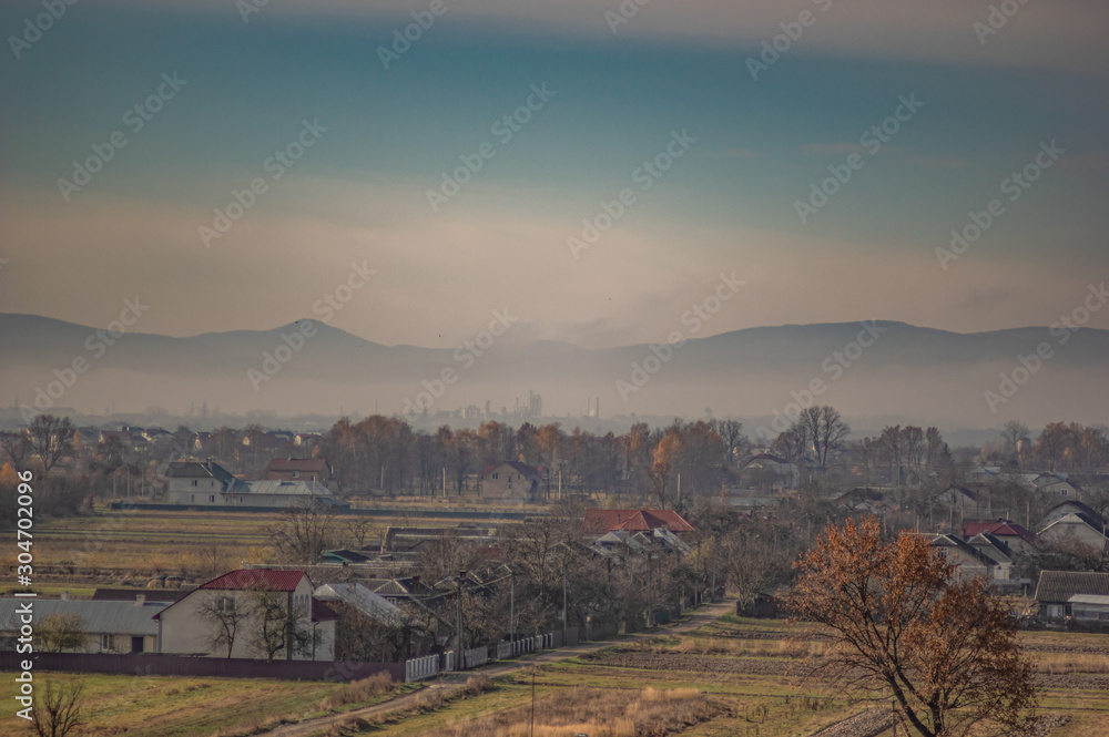 Village in the autumn afternoon in a haze