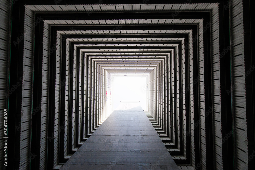 Fototapeta premium Looking up view of a square building