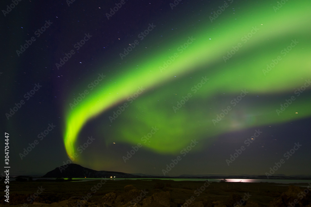 Mixed colorful aurora borealis dancing in the sky