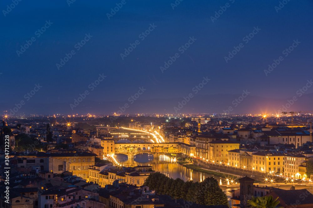 Night view of the old city in Florence over the Ponte Vecchio, Florence, Italy