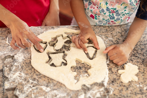 Family making Christmas cookies at home