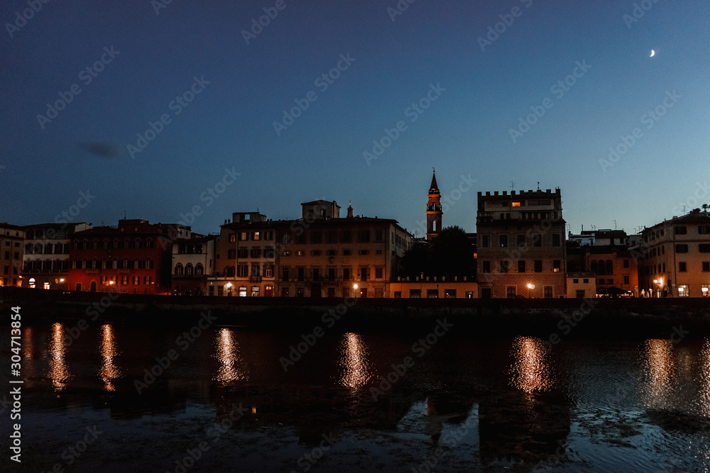 Fototapeta premium Evening lights of Florence waterfront | FLORENCE, ITALY - 14 SEPTEMBER 2018. 