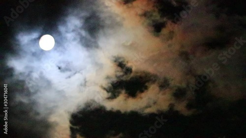 Moon and strange clouds in the night