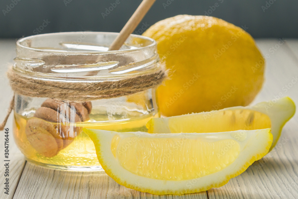 lemon and honey on wooden backgrond lemon and honey on wooden backgrond