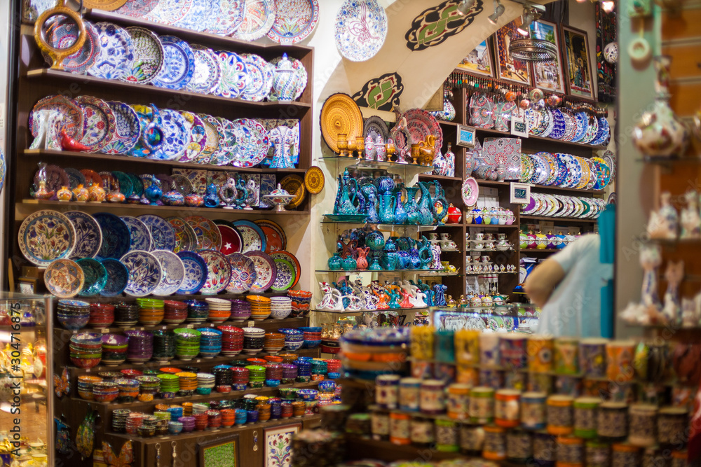 Traditional Turkish ceramics on the Grand Bazaar. souvenir shop with plates, textile, cups, gift