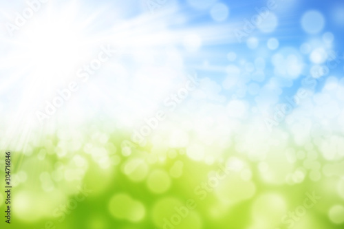 Green and blue blurred summer background with shining sun and with Bokeh