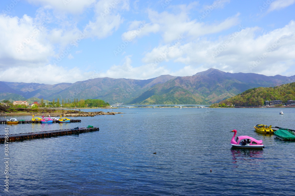 Fujikawaguchiko / Japan - May 02 2019: Blue sky and blue lake. Swan boat rental. Landscape beautiful Lake Kawaguchiko