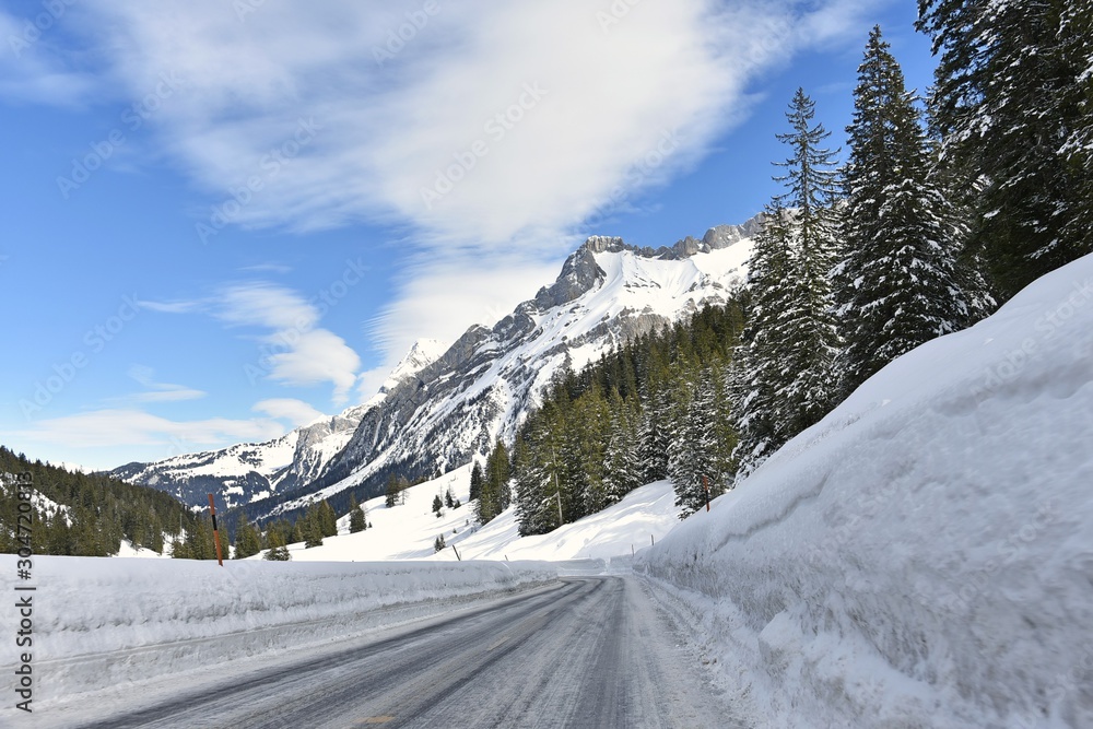 Fototapeta premium winter mountain road and snow walls