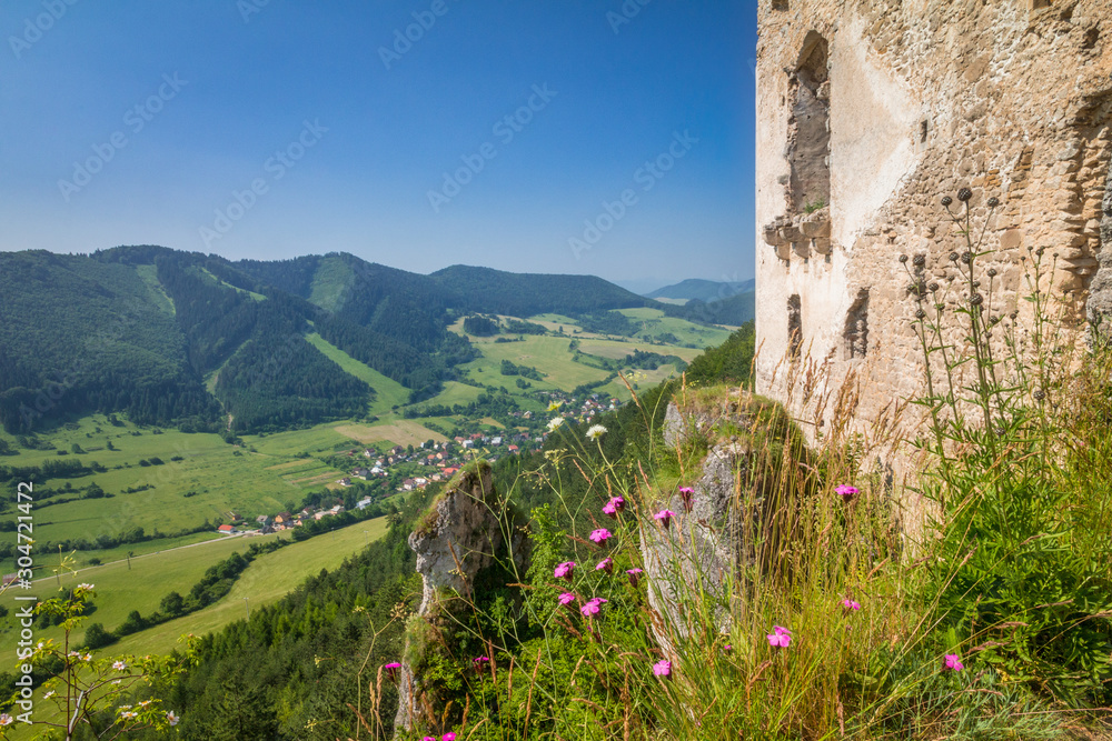 Wall of the ruins of a medieval castle Lietava above the surrounding landscape, nearby Zilina town, Slovakia, Europe.